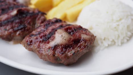 grilled meatballs with rice and fries