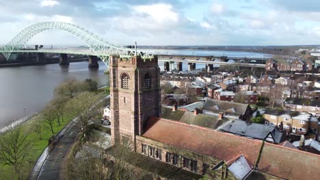 aerial view industrial widnes small town jubilee bridge church rooftops neighbourhood north west england descending