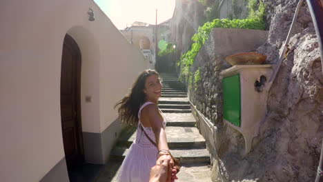 couple walking through a charming italian alley