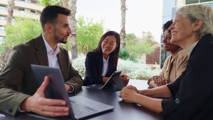 Business team collaborating in an outdoor meeting