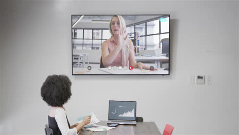 African-american-businesswoman-on-video-call-with-caucasian-female-colleague-on-screen