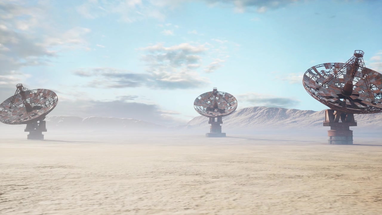 Dilapidated satellite structures amid dusty desert and mountain silhouettes