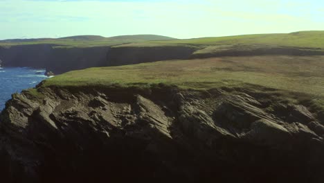 aerial view of dramatic cliffs and coastline