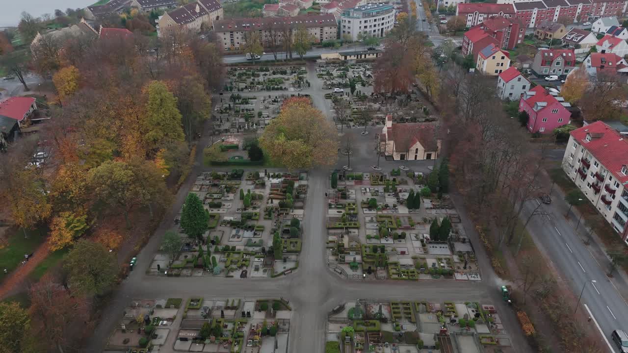Aerial view of a graveyard in the small town Ystad, in Österlen, South Sweden, cloudy, autumn