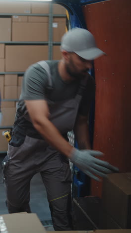 warehouse workers moving boxes and handling packages