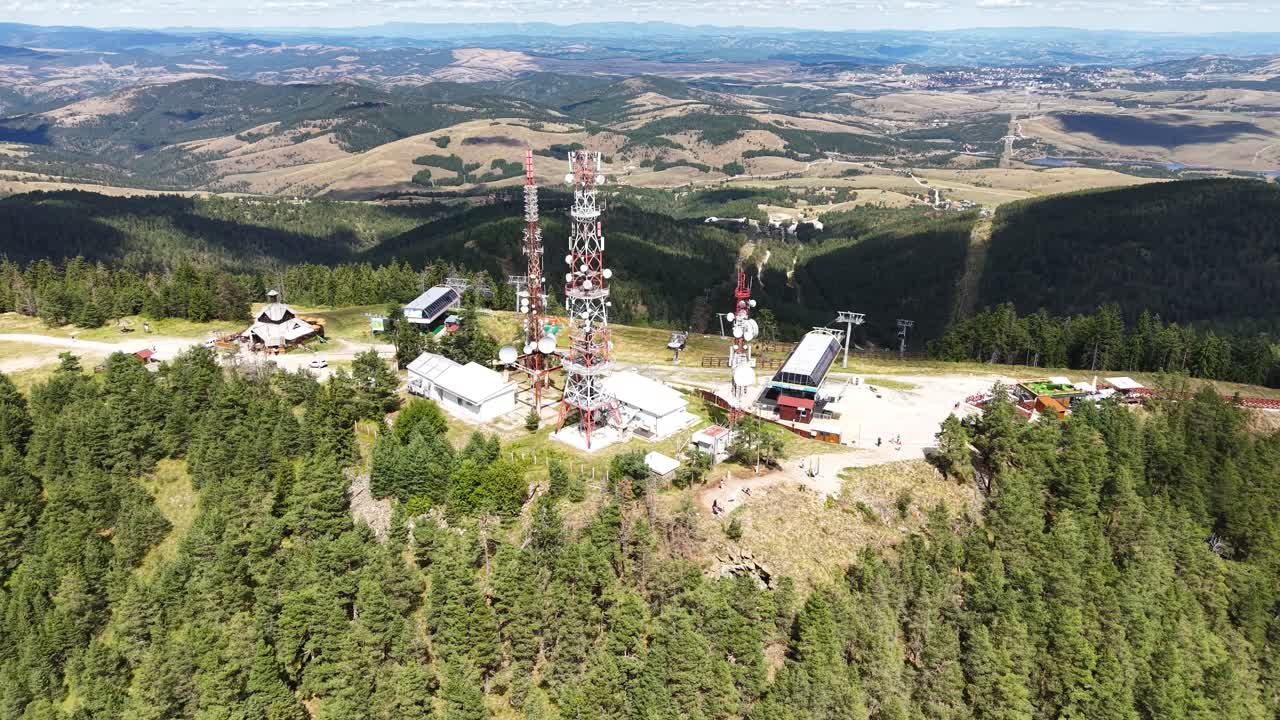 Zlatibor, Serbia. Flying Above Tornik Summit, Communication Towers, Gondola and Ski Lift Stations, Green Pine Forest