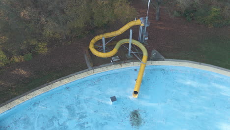 low-aerial-of-waterslide-at-deserted-swimming-pool