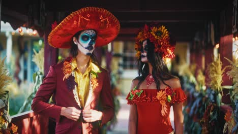 couple in day of the dead costumes