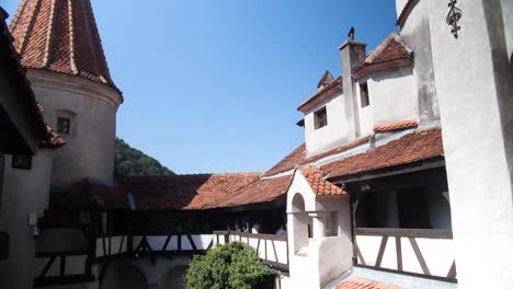 exploring the courtyards of bran castle in transylvania, romania