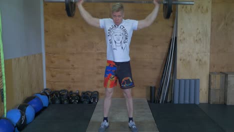 man performing barbell back squat