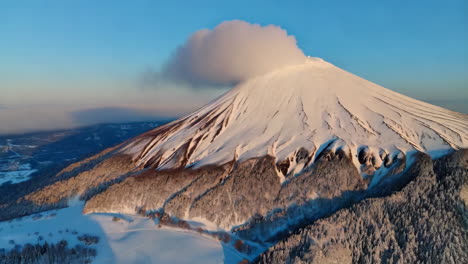 snow-covered volcano at sunrise