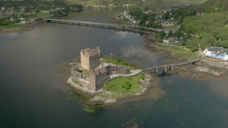 an aerial view of eilean donan castle on a sunny day