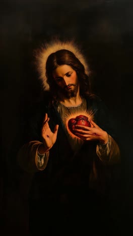 a dramatic, low-angle video frame of a sacred heart painting, capturing a serene, divine figure