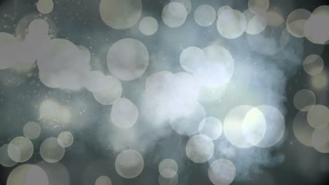 animation of white bokeh christmas lights over smoke on black background