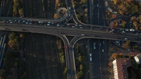 busy traffic on overpass in bucharest during golden hour, dynamic city life, aerial view