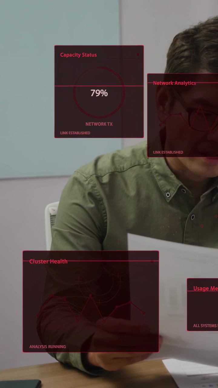 Vertical video: Analyst taking charts and checking graphs, monitoring red panels for network load