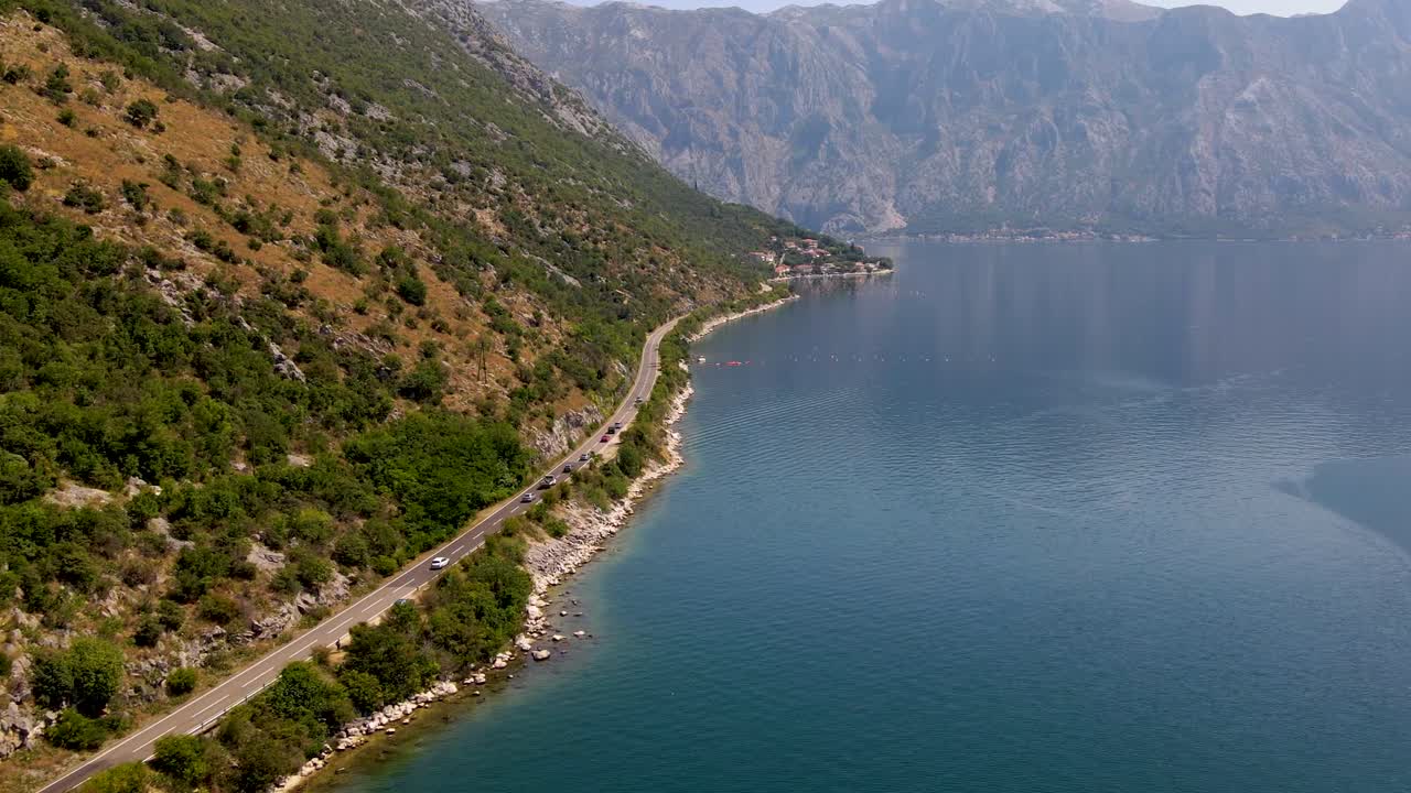 Aerial Cinematic View Of The Mountain Road In Kotor, Montenegro On A Sunny Day