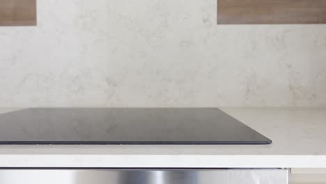 close up of a modern induction stovetop in a kitchen