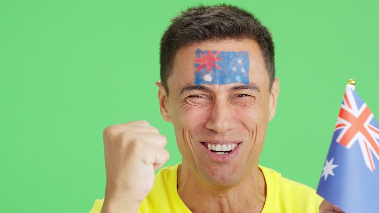 Close up of a man supporting australian team