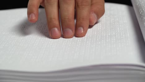 person reading braille book
