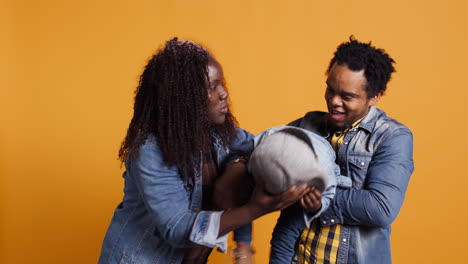 African-american-happy-family-fooling-around-together-on-camera