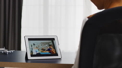 Happy-woman-during-a-video-meeting-on-tablet-computer