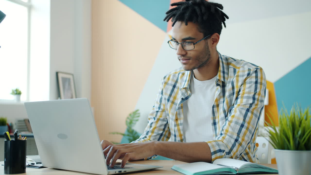 Man Working on Laptop in Home Office