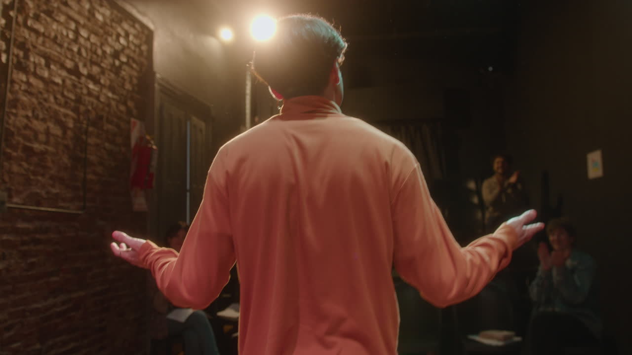 Actor Bowing from Theater Stage after Solo Performance