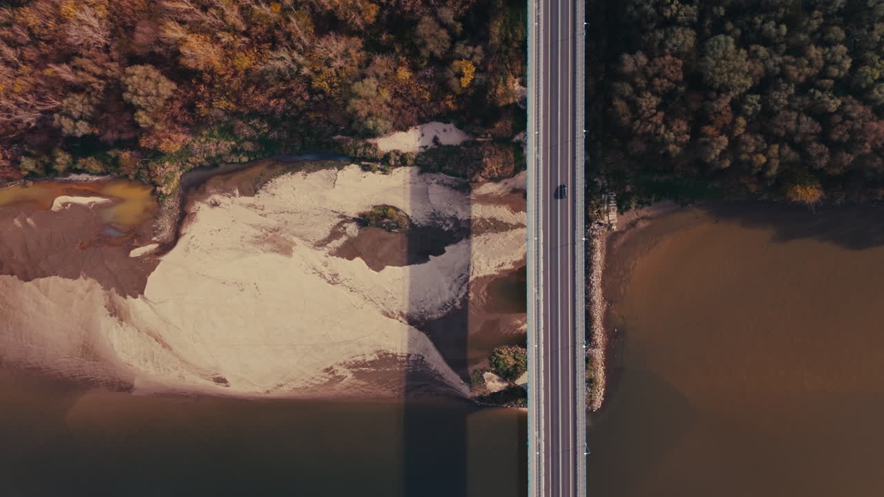 Aerial View of Bridge Over River with Autumn Forest
