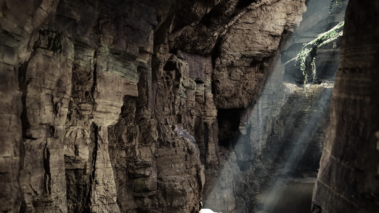 Mystical light beams shine into ancient cave revealing hidden beauty