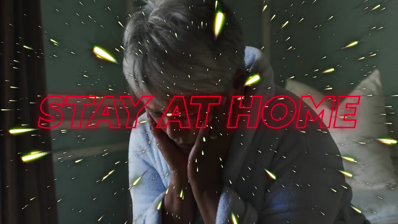 침대에 앉아 있는 스트레스를 받은 아프리카계 미국인 여성에 대한 네온 텍스트와 빛의 트레일