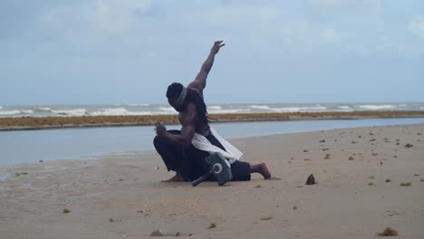 on a tropical beach, a muscular, dark-skinned man in nekharis cosplay is a striking sight