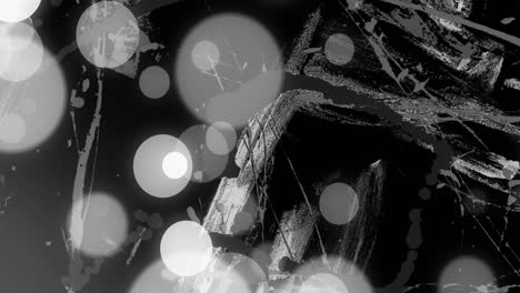 animación de círculos de luz grises y blancos sobre pinceladas blancas en movimiento sobre fondo negro