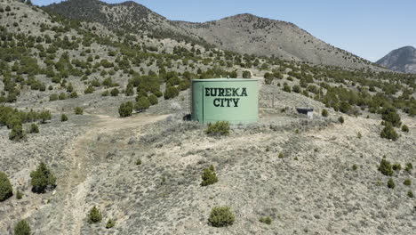 slow aerial push in shot over the water tower in the town of eureka city utah