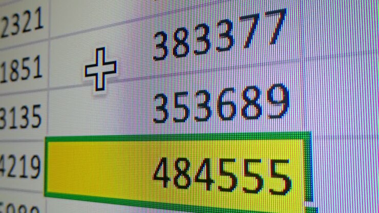 Spreadsheet showing numbers and a plus symbol