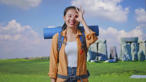 happy tourist woman at stonehenge