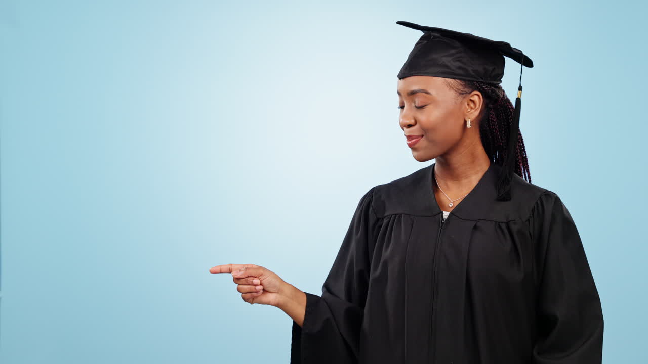 Graduation, woman pointing