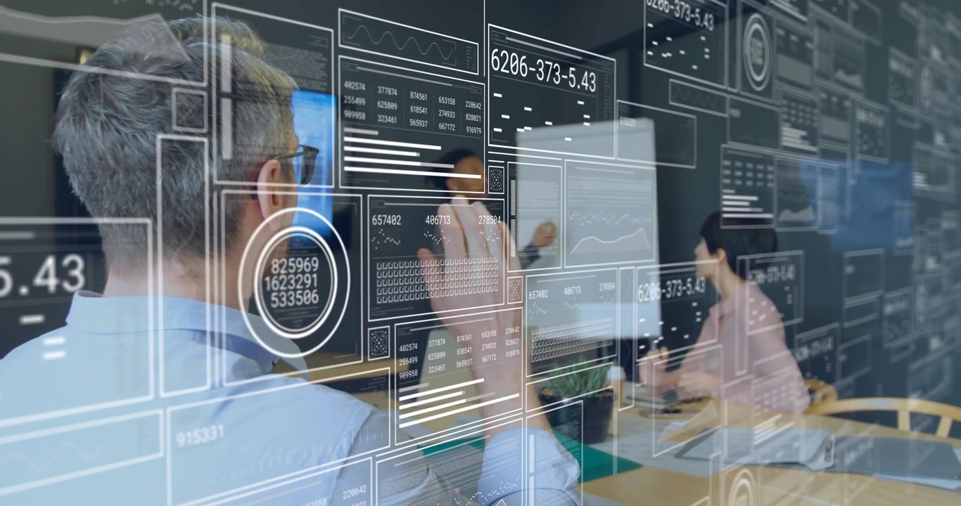 Business team around table interacting with AR data overlay updating when colleague raising hand