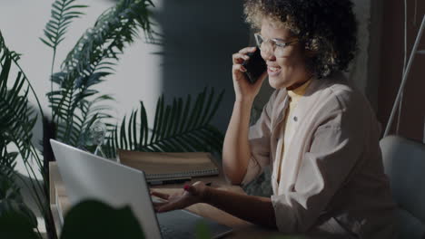 woman on phone call in home office