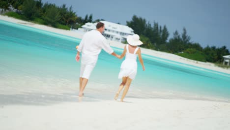 attractive caucasian couple enjoying their vacation on beach