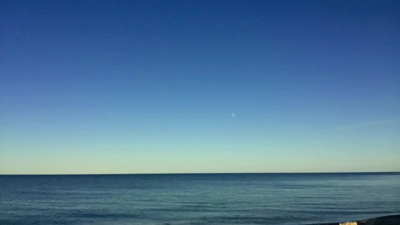 Seascape with a Calm Ocean and Blue Sky