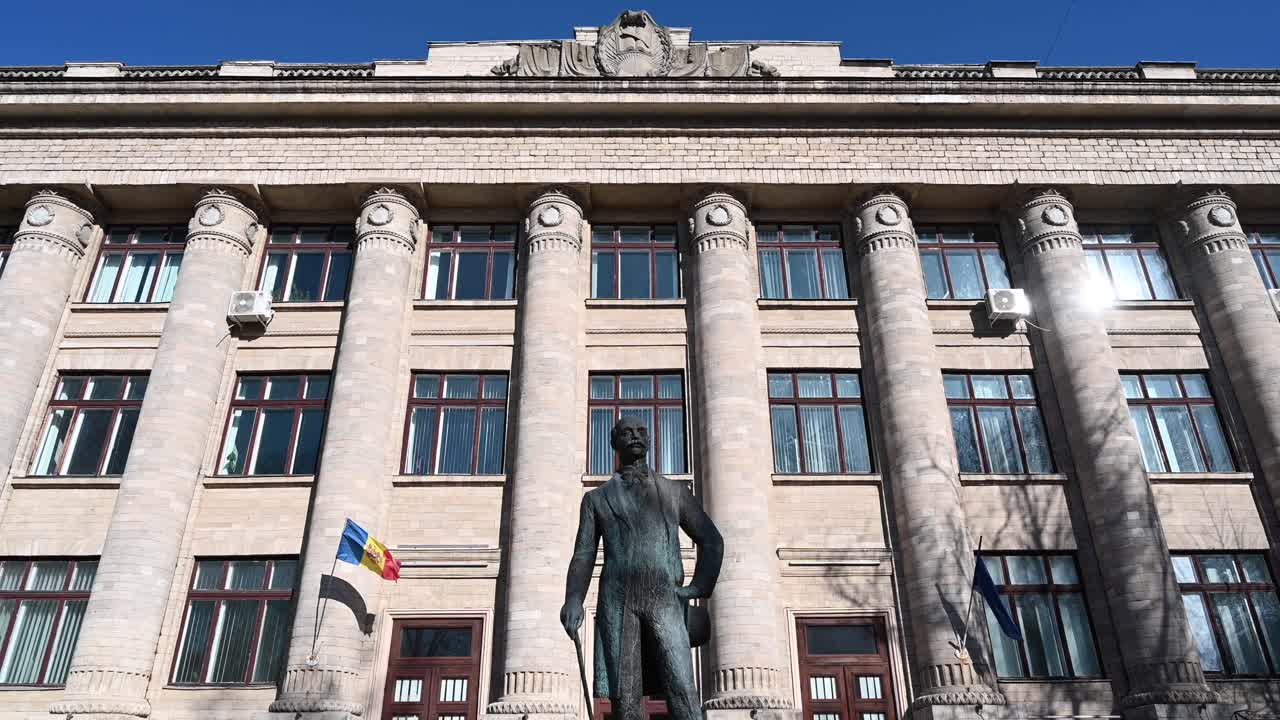 Vasile Alecsandri's bronze statue in front of National Library of Moldova in Chisinau