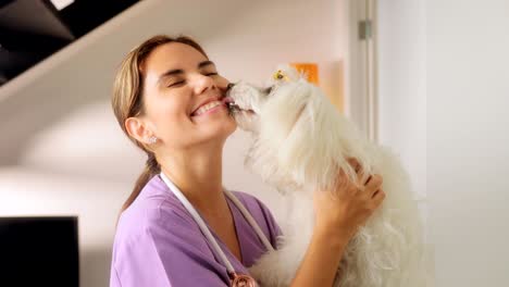 portrait of happy vet smiling at camera with dog