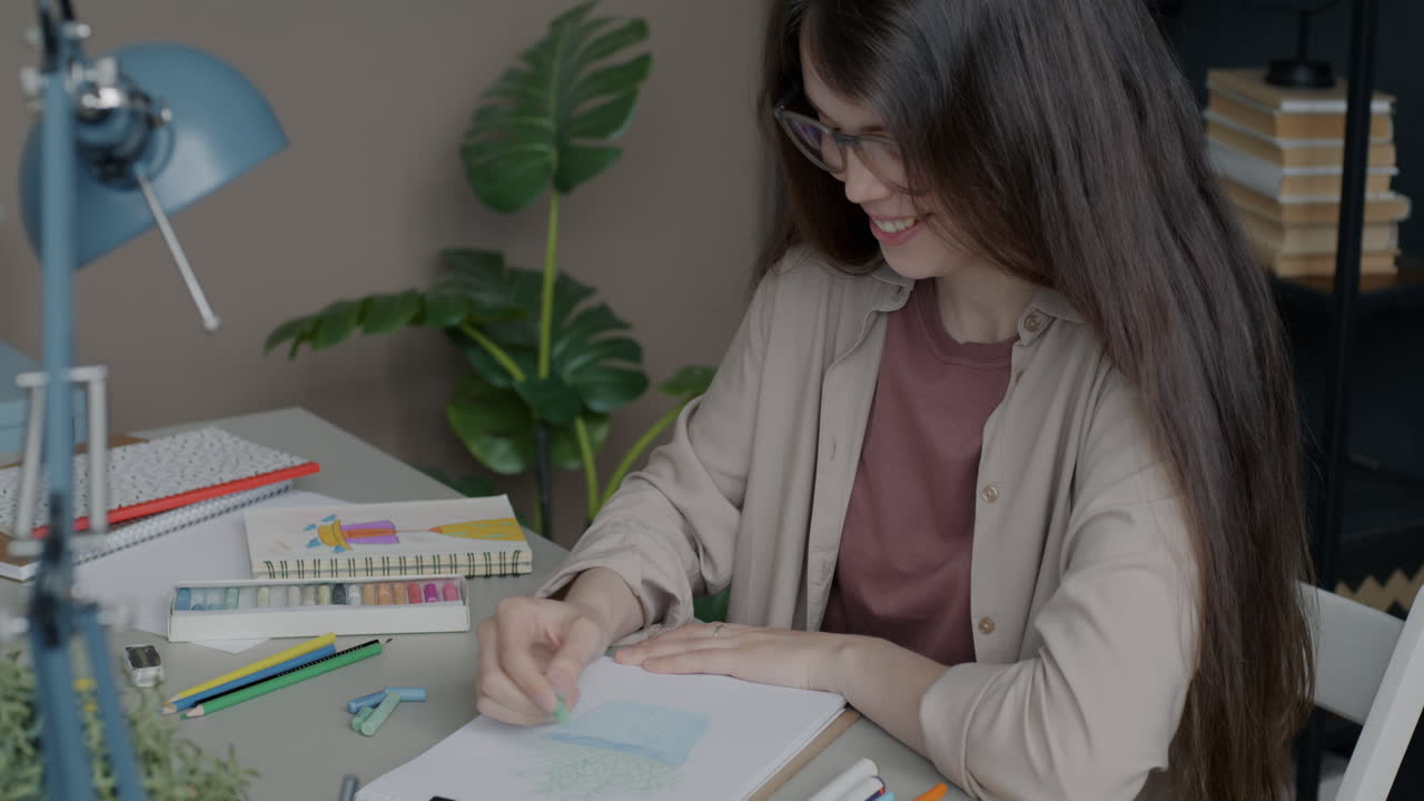 Woman Drawing with Colored Pencils