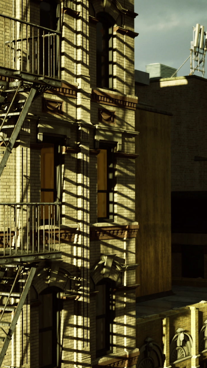Light and shadow on brick wall in urban street with fire escape