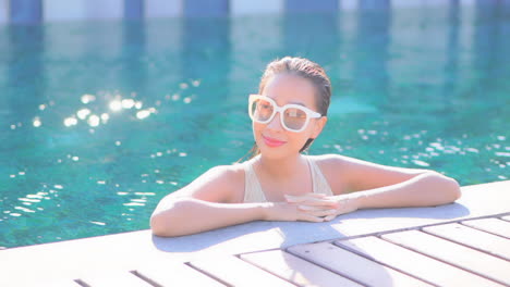 Classy-Exotic-Woman-in-Swimming-Pool-Enjoying-on-Hot-Summer-Day,-Full-Frame,-Close-Up