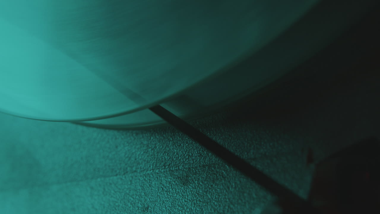 Extreme Close-Up of Reel-to-Reel Tape Player Spool during Music Recording