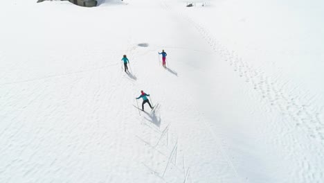 group of friends during cross country ski holiday in jura mountains of france - valley combe a la chèvre