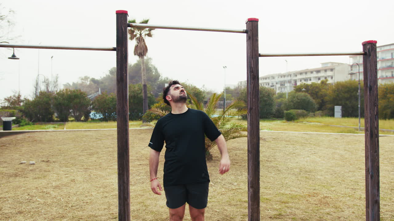 Man Training Doing Pull Ups At The Park Gym
