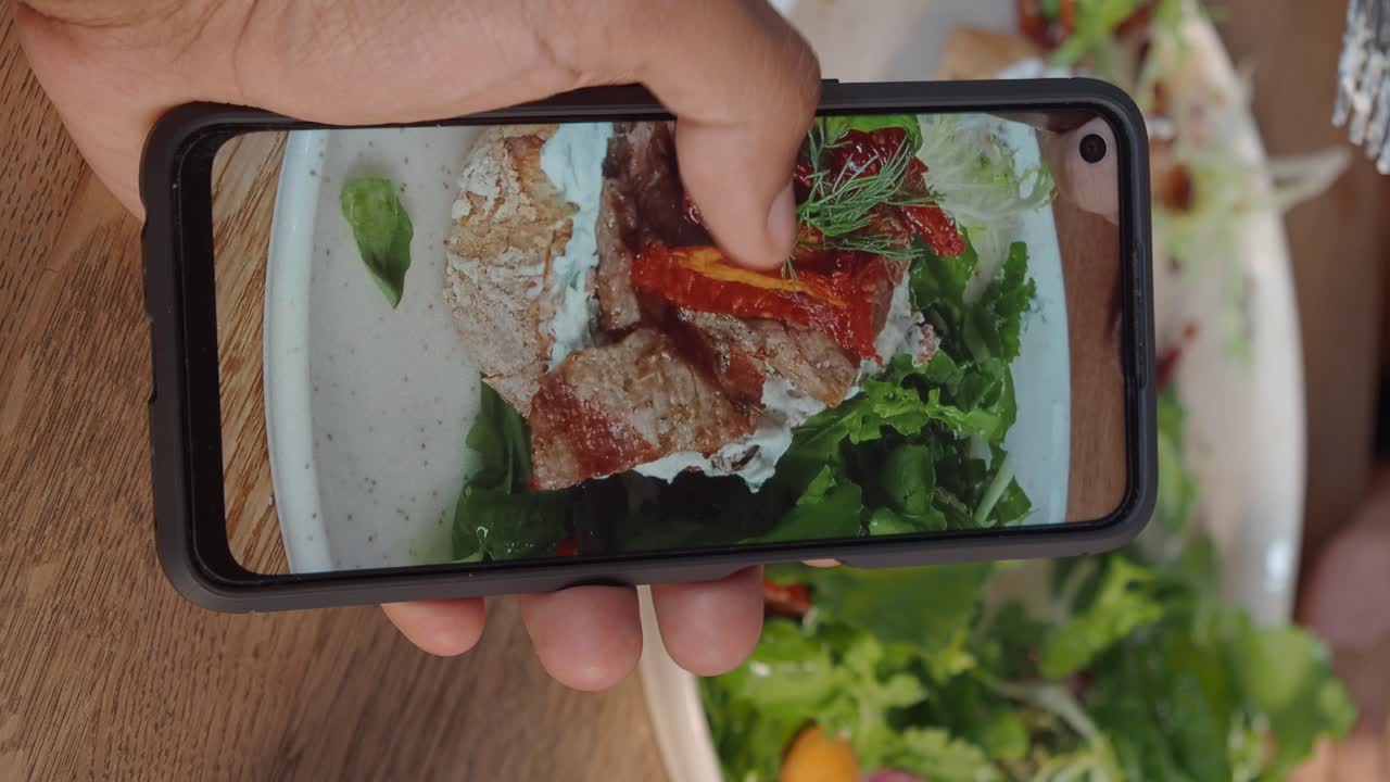 Taking a photo of a salad sandwich